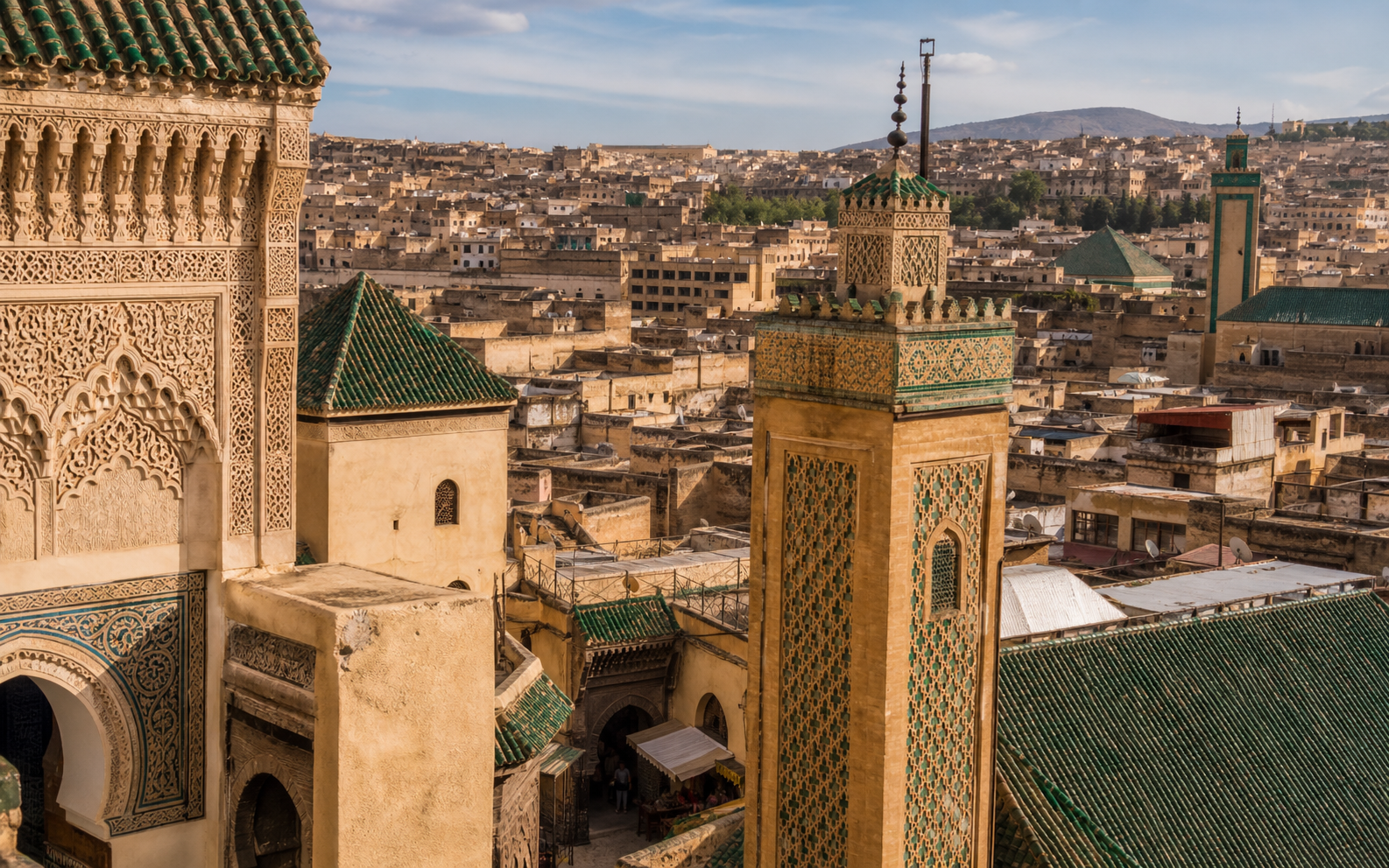 Fes old medina with green-tiled minarets and carved architecture